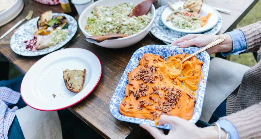 Fire roasted sweet potatoes can be made ahead to make Thanksgiving Day easier on the host.
