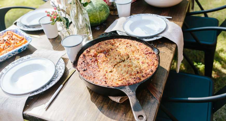 Bacon cornbread dressing in a cast iron skillet