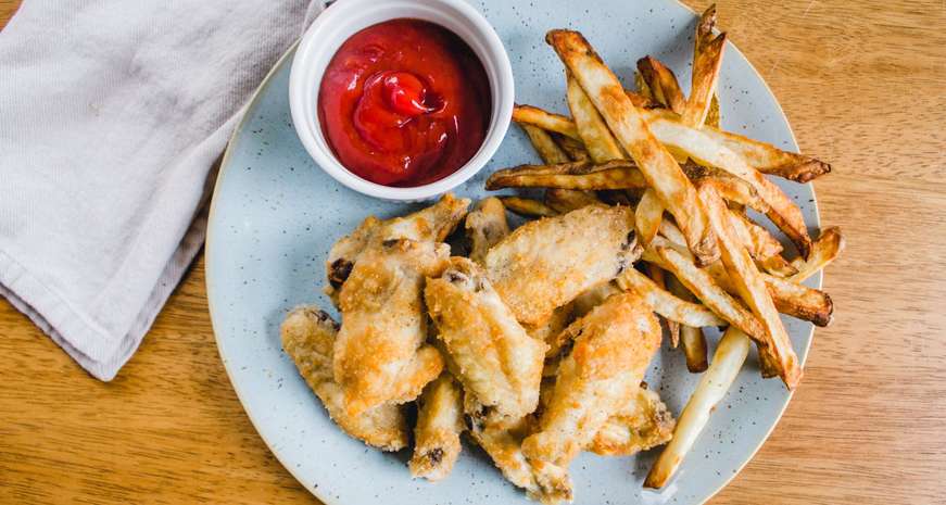 Air fryer chicken wings and french fries