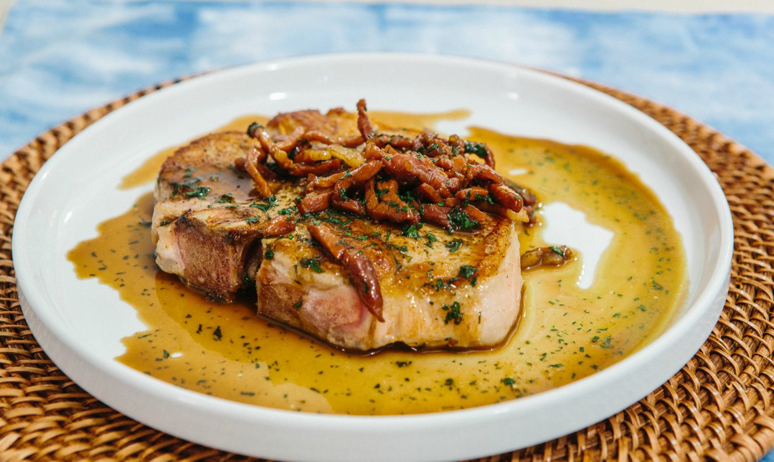 Cast Iron Seared Pork Chop With Red Eye Gravy Southern Kitchen The bone and the surrounding fat that encircles the chops keep them flavorful during the cooking process. cast iron pork chop with red eye gravy